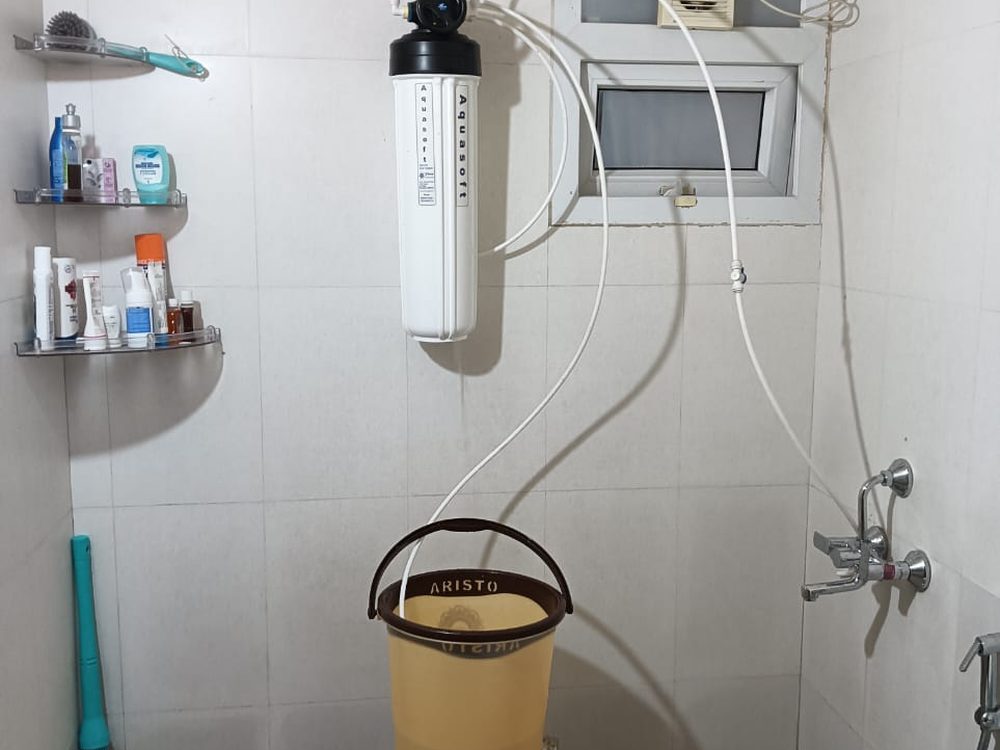 Pre-filter housing installed in commercial bathroom